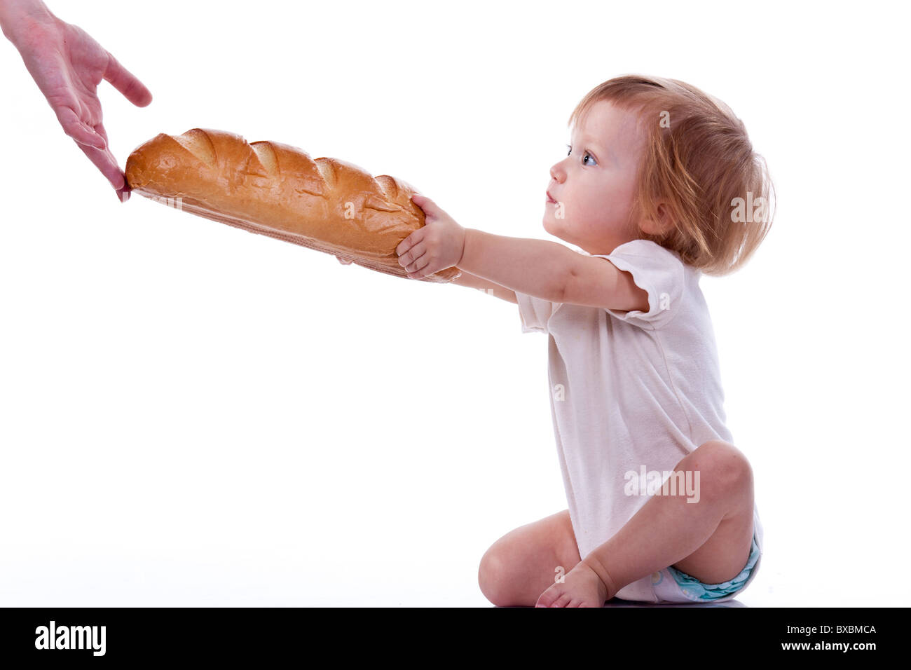Baby giving out a loaf of bread isolated on white Stock Photo