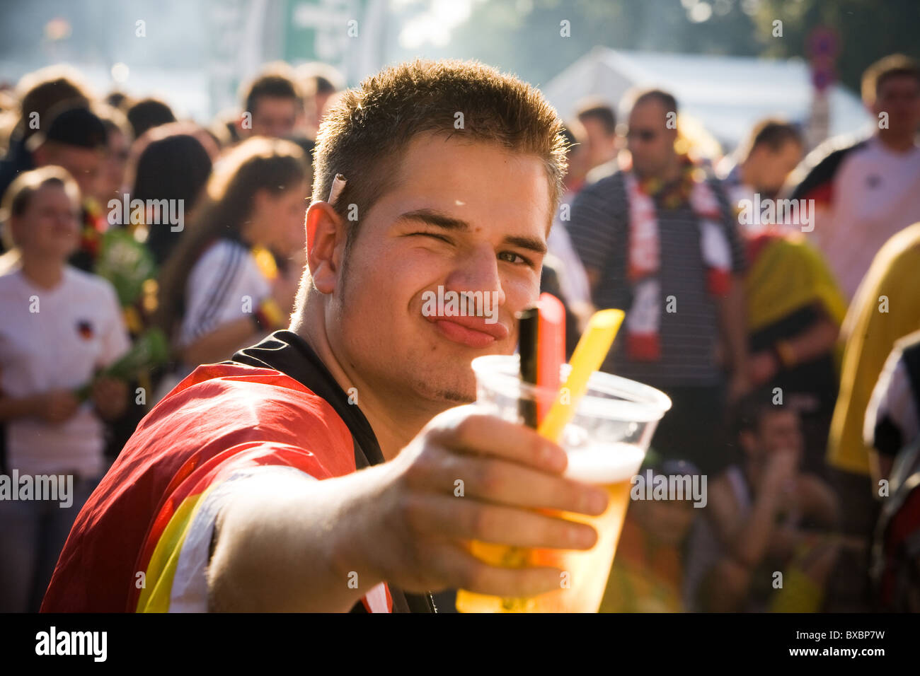Cheers! A football fan during the final of the European Championship, Berlin, Germany Stock Photo