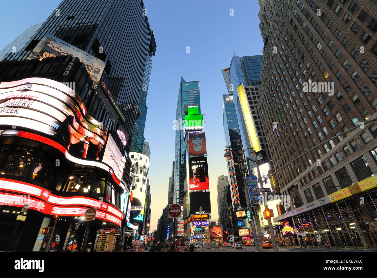 Storefronts and advertisements in Times Square New York City at dawn. Stock Photo