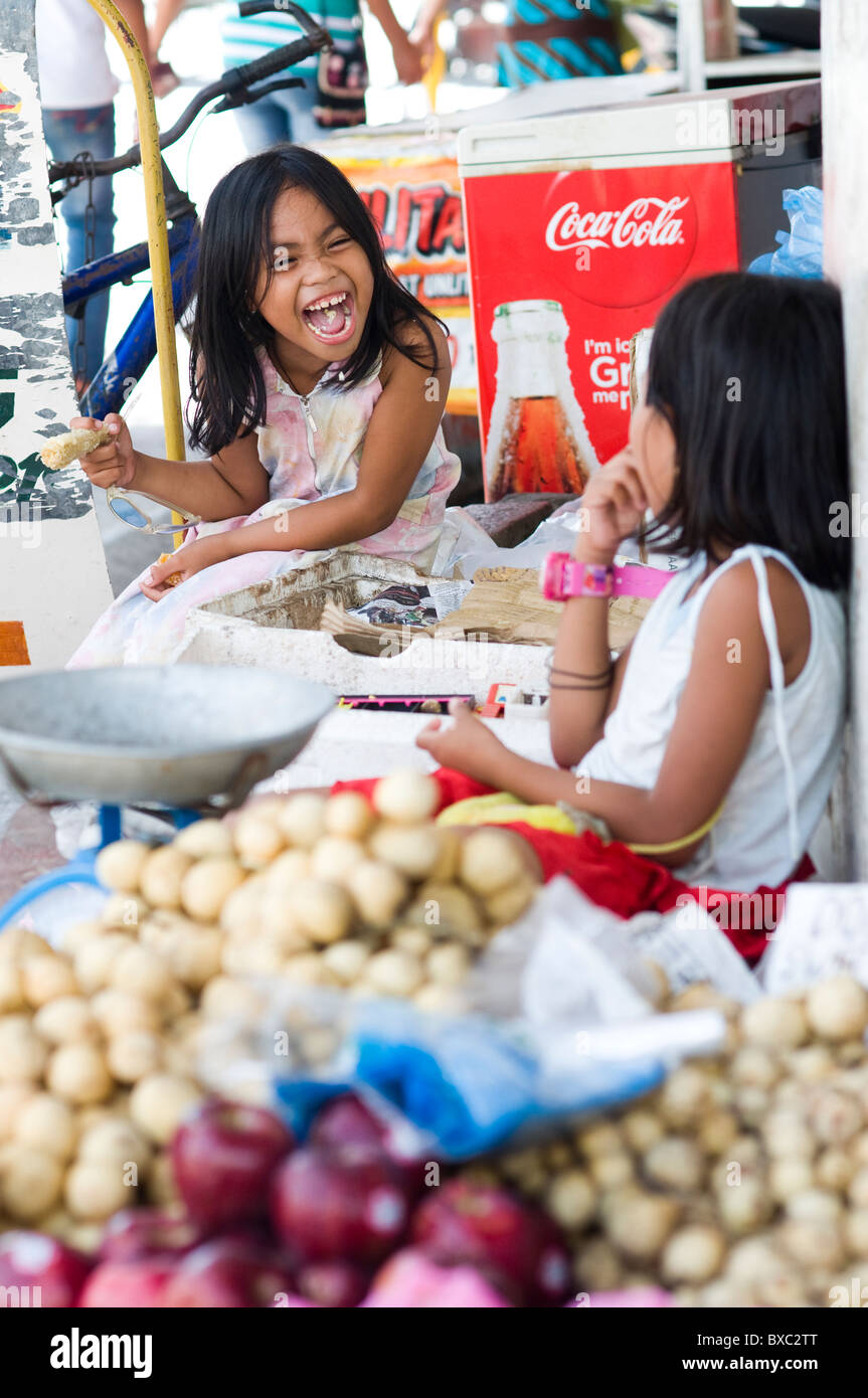 Kids in hawker stall, San Carlos, Negros Occidental, Philippines Stock  Photo - Alamy
