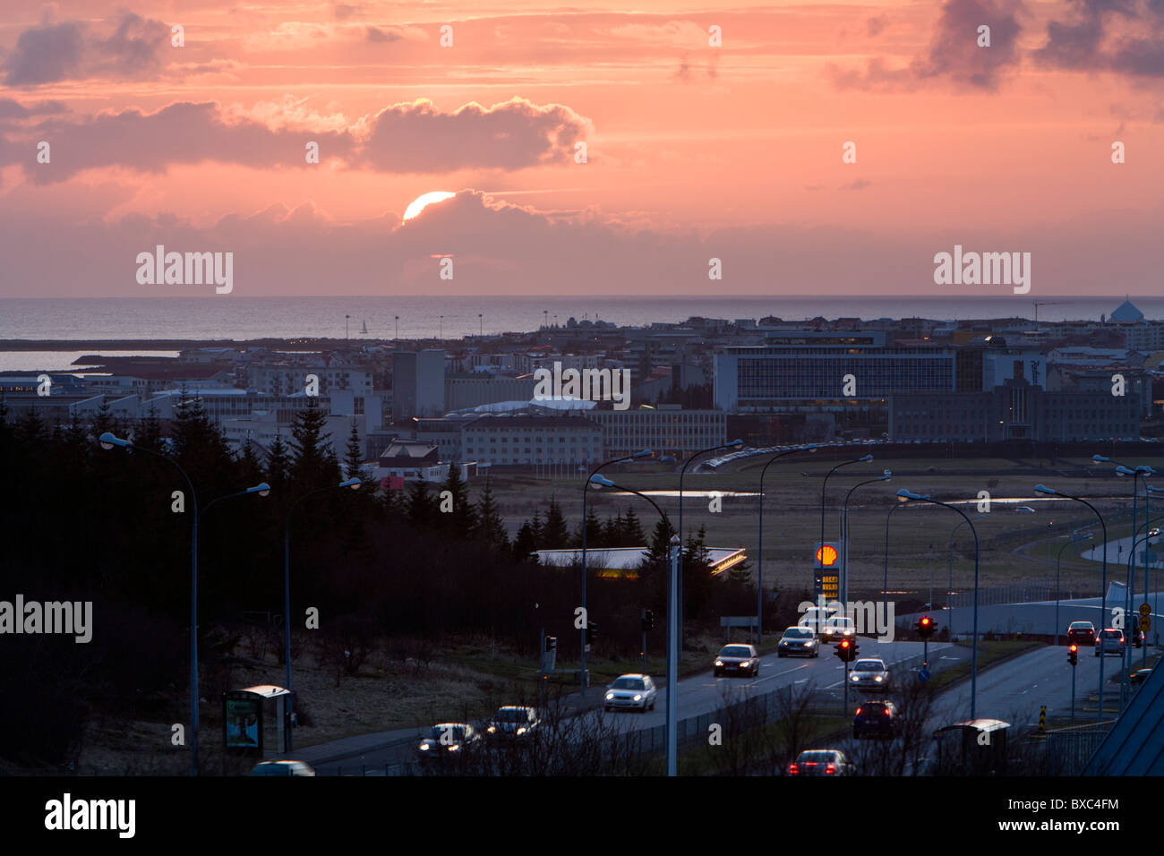 Cars driving at 9pm, sunset. Reykjavik Iceland Stock Photo