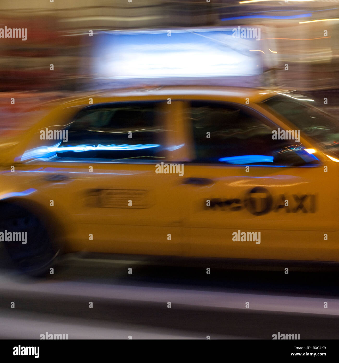 Blurred image of a yellow taxi in Manhattan, New York City, U.S.A. Stock Photo