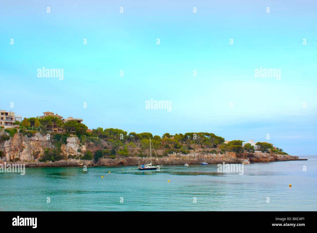 single boat moored in bay in porto cristo majorca Stock Photo