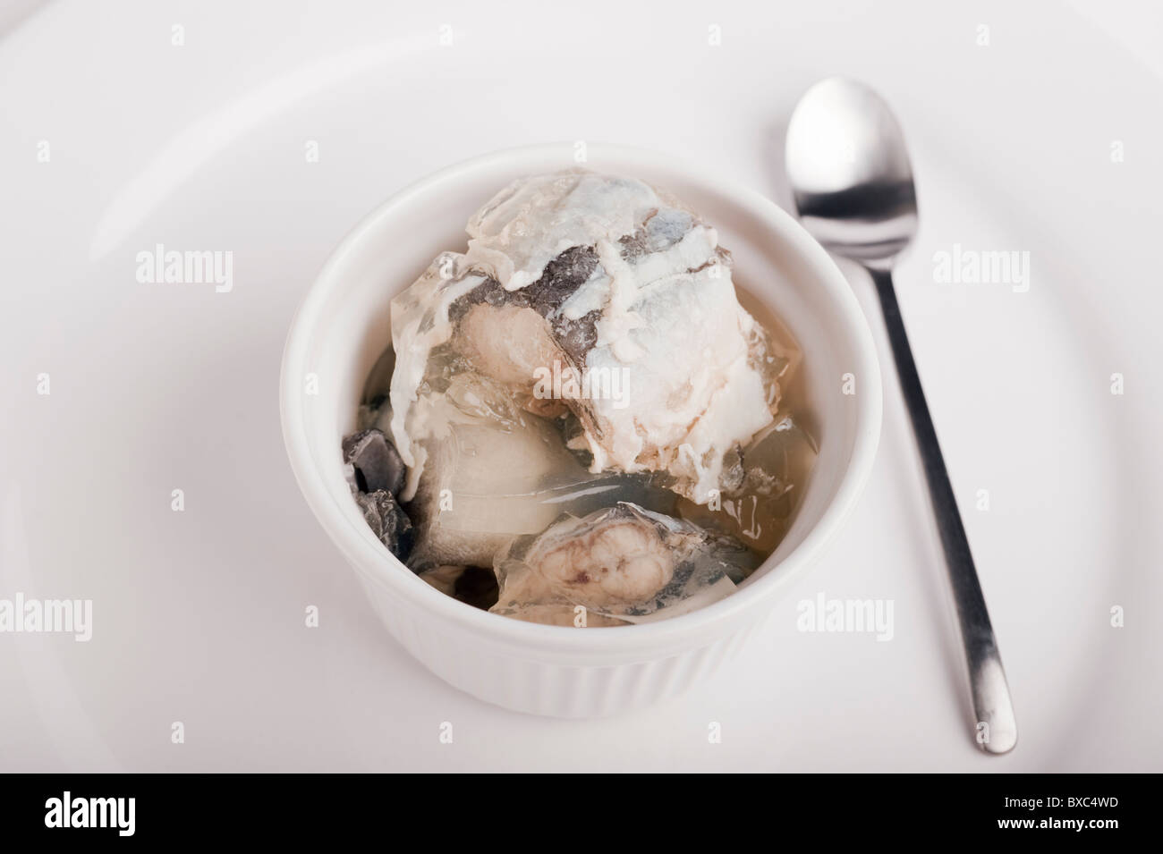 Tub Of Jellied Eels with a Spoon Stock Photo