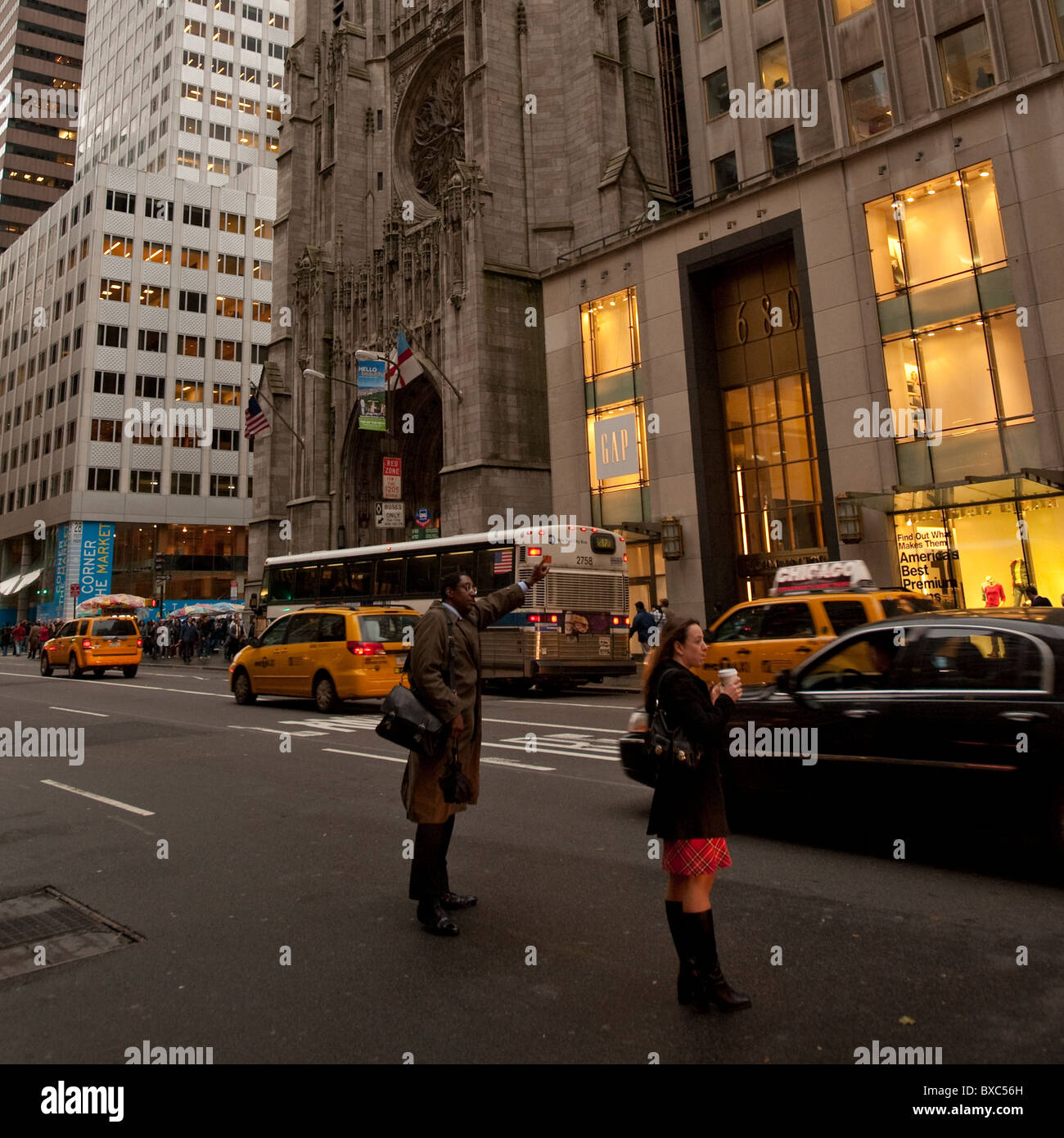 People hailing a cab on Fifth Avenue in Manhattan, New York City, U.S.A. Stock Photo