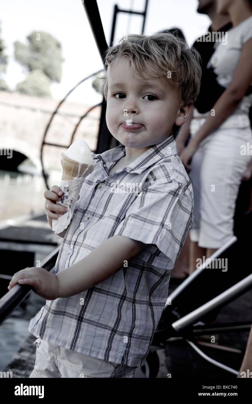 Little boy eating an ice cream cone Pescheira de Garda Italy Stock Photo
