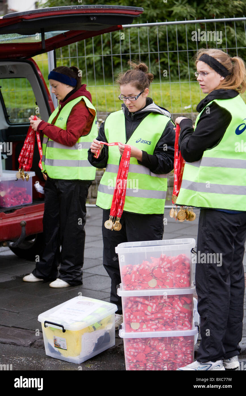 2009 Reykjavik Marathon, women getting the medals ready for the runners. Reykjavik Iceland Stock Photo