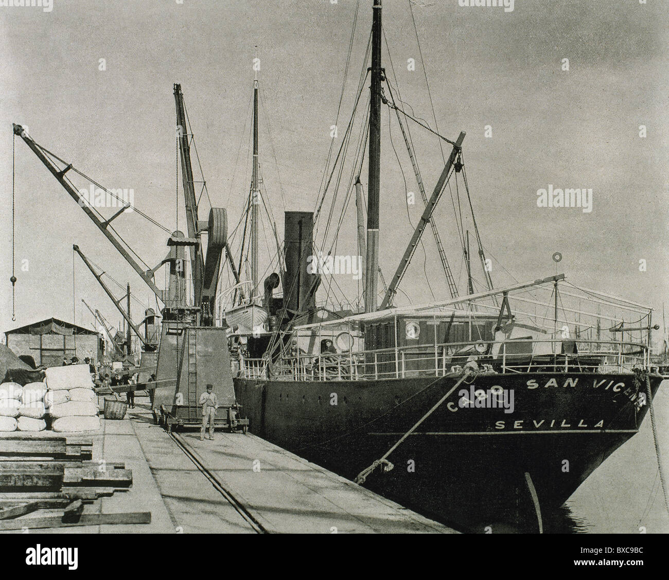 Spain. Catalonia. Barcelona. Ship and cranes at the dock. Late nineteenth century. Stock Photo
