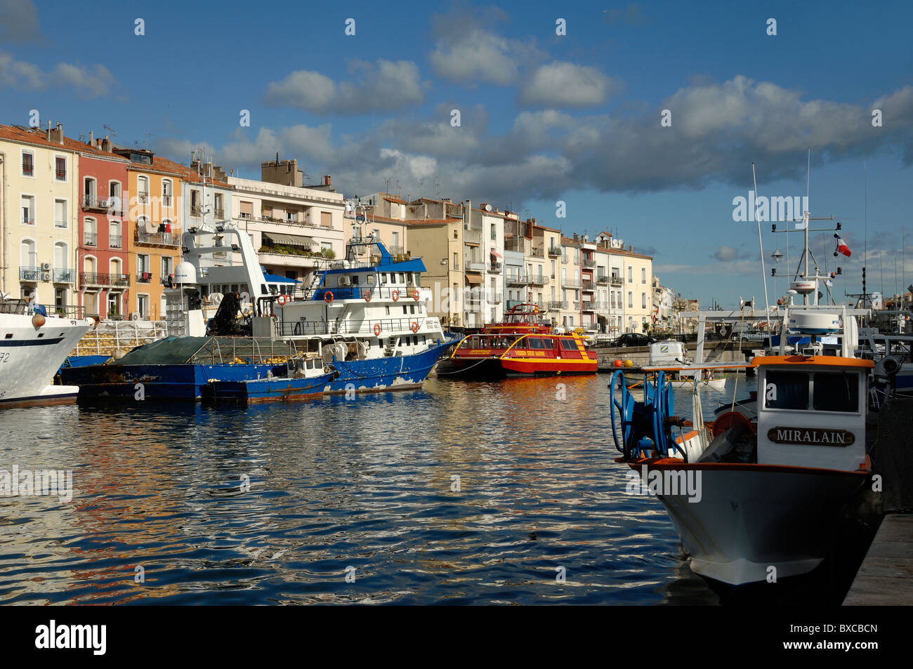 Fishing Boats and Canalside Houses or Housing on the Canal Royal, Quai de la Resistance, Sète, Hérault, France Stock Photo