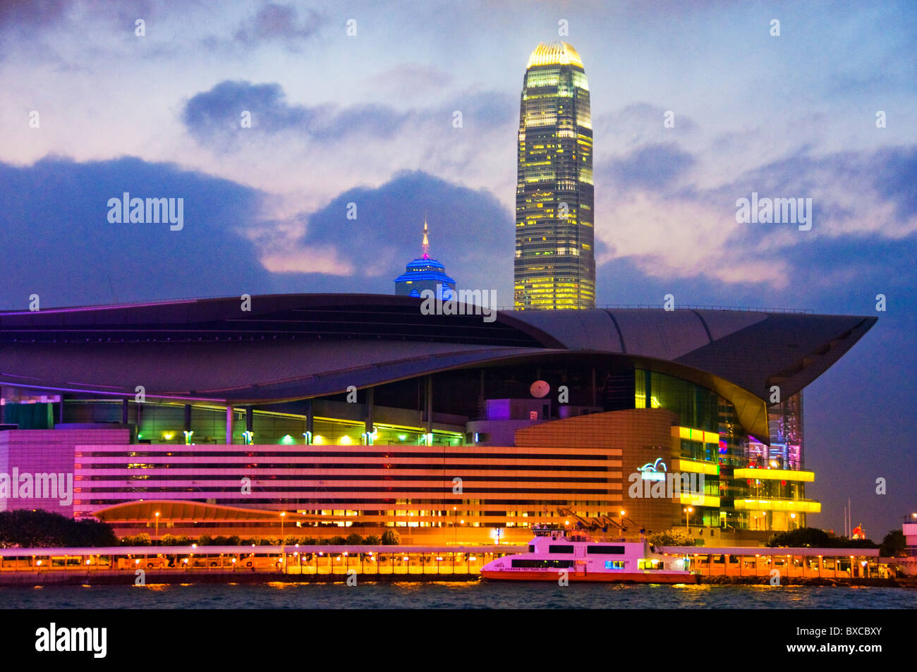 Skyline and harbor view of Hong Kong China Convention and Exhibition Centre at night Stock Photo