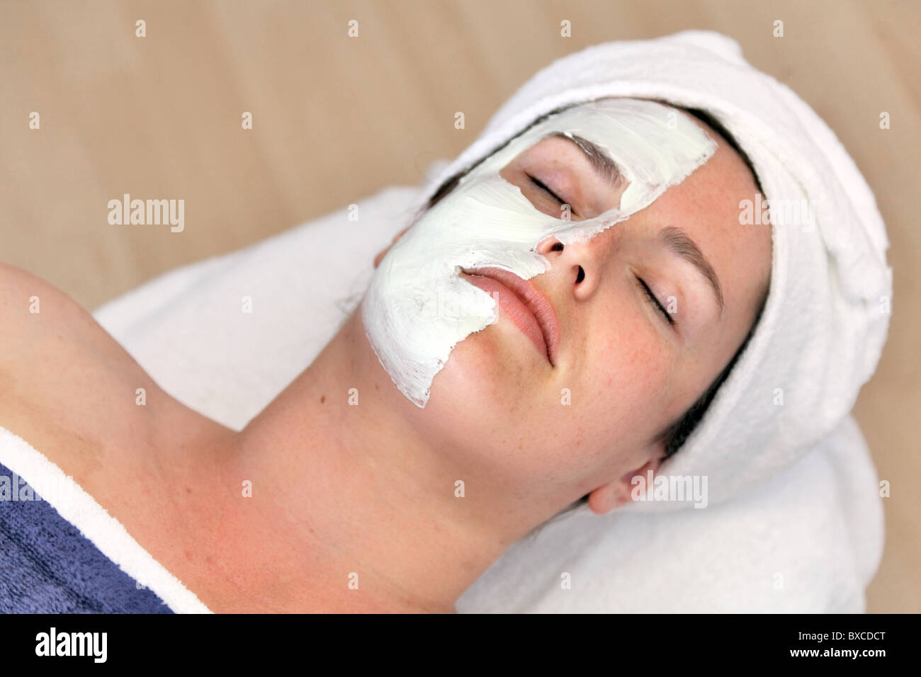 Woman with a facial mask Stock Photo - Alamy