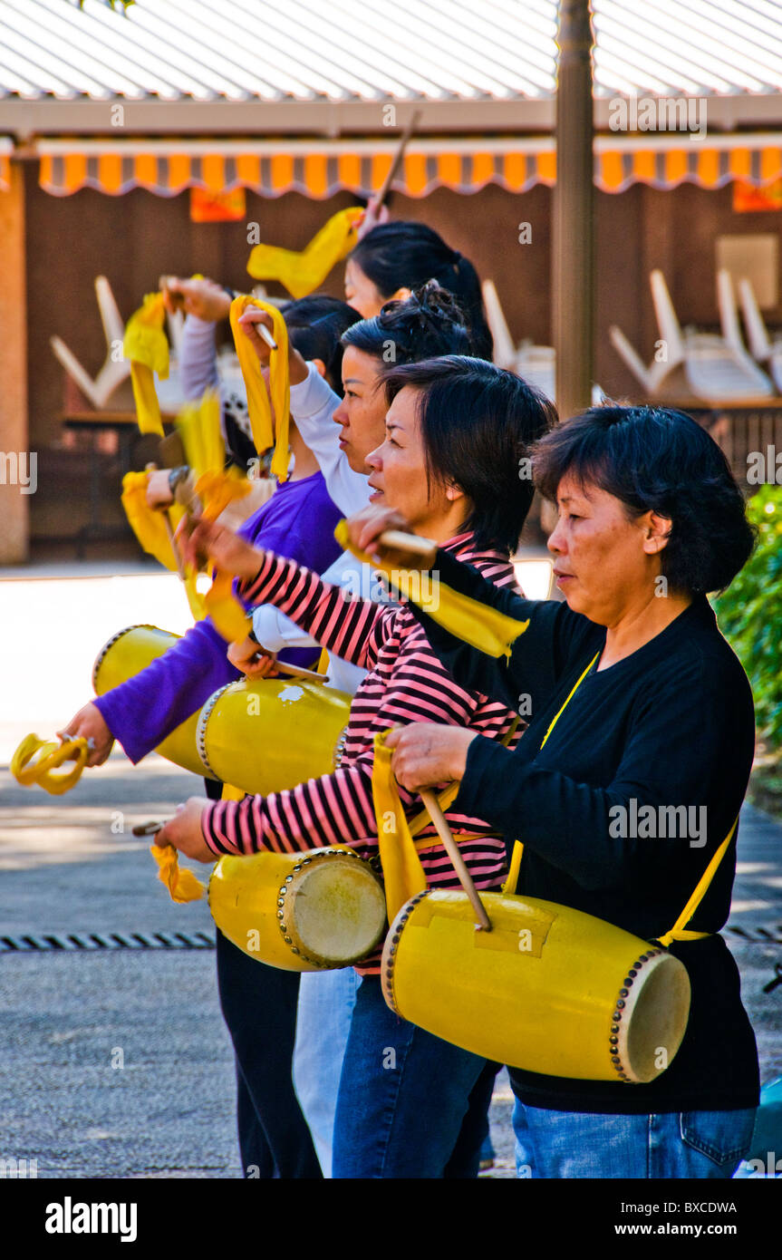 Asian woman practicing drums in park in Hong Kong China Stock Photo Alamy