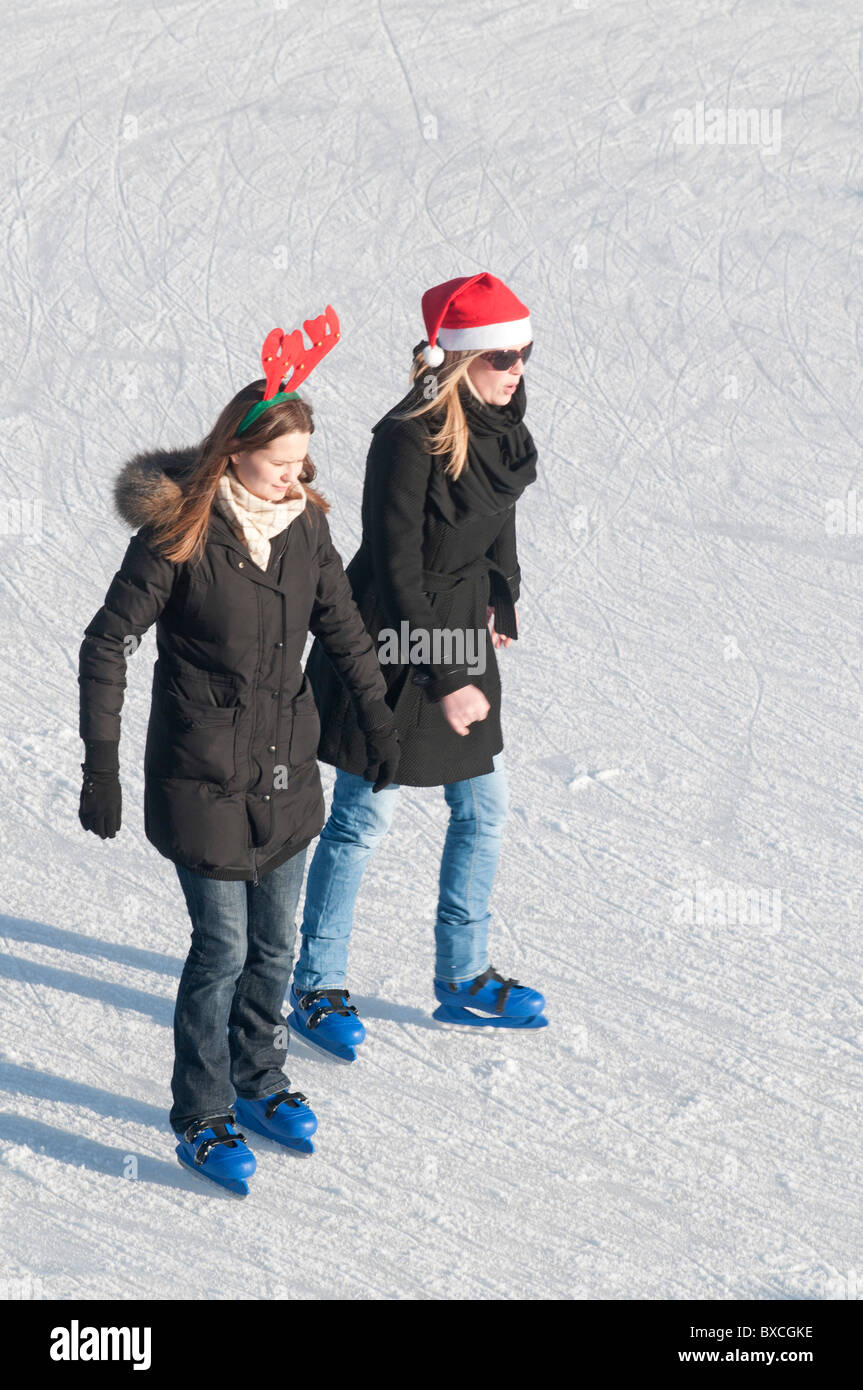 Skaters enjoying the Outdoor Temporary Christmas Ice Rink set up