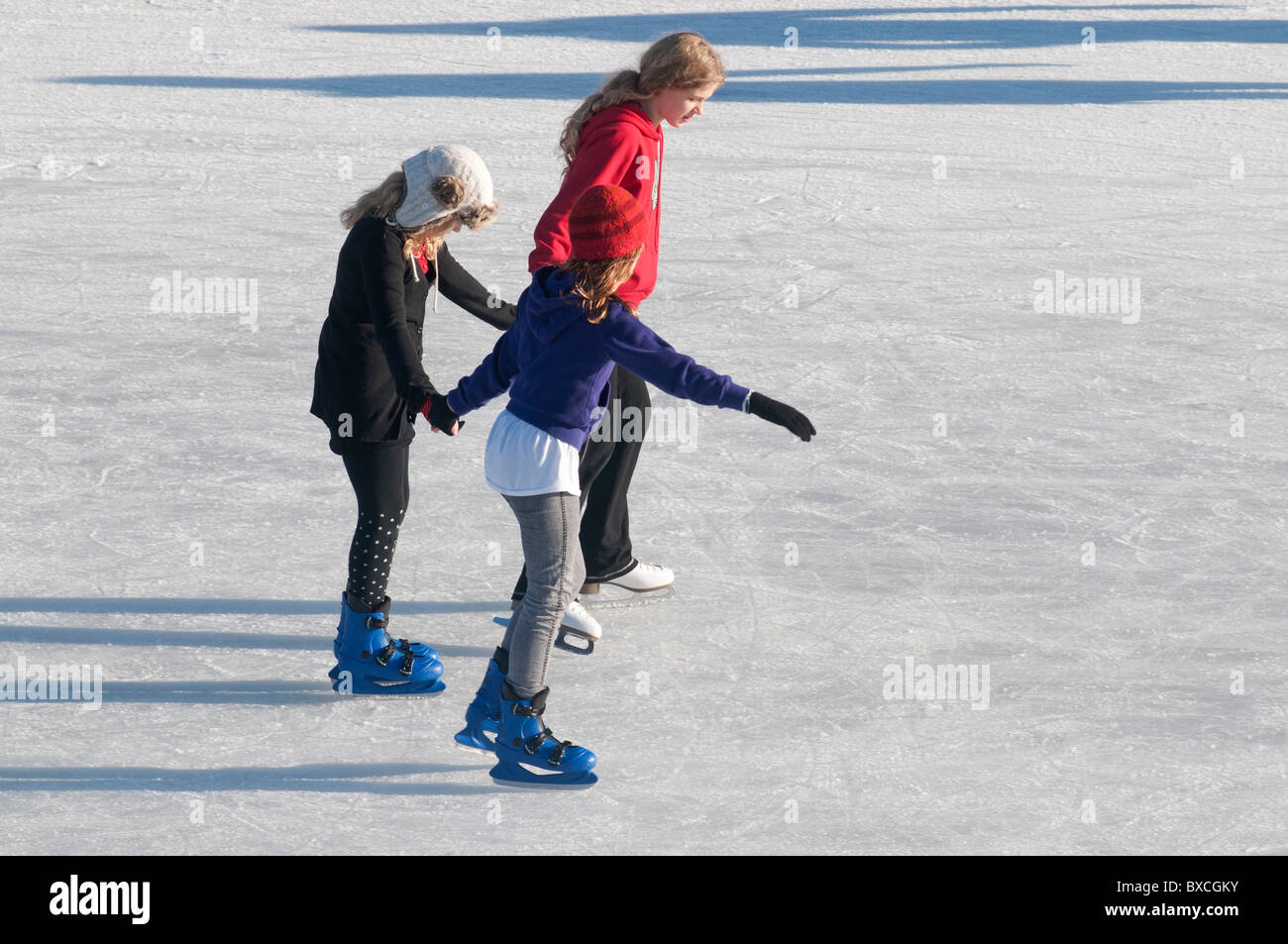 Children enjoying the Outdoor Temporary Christmas Ice Rink set up