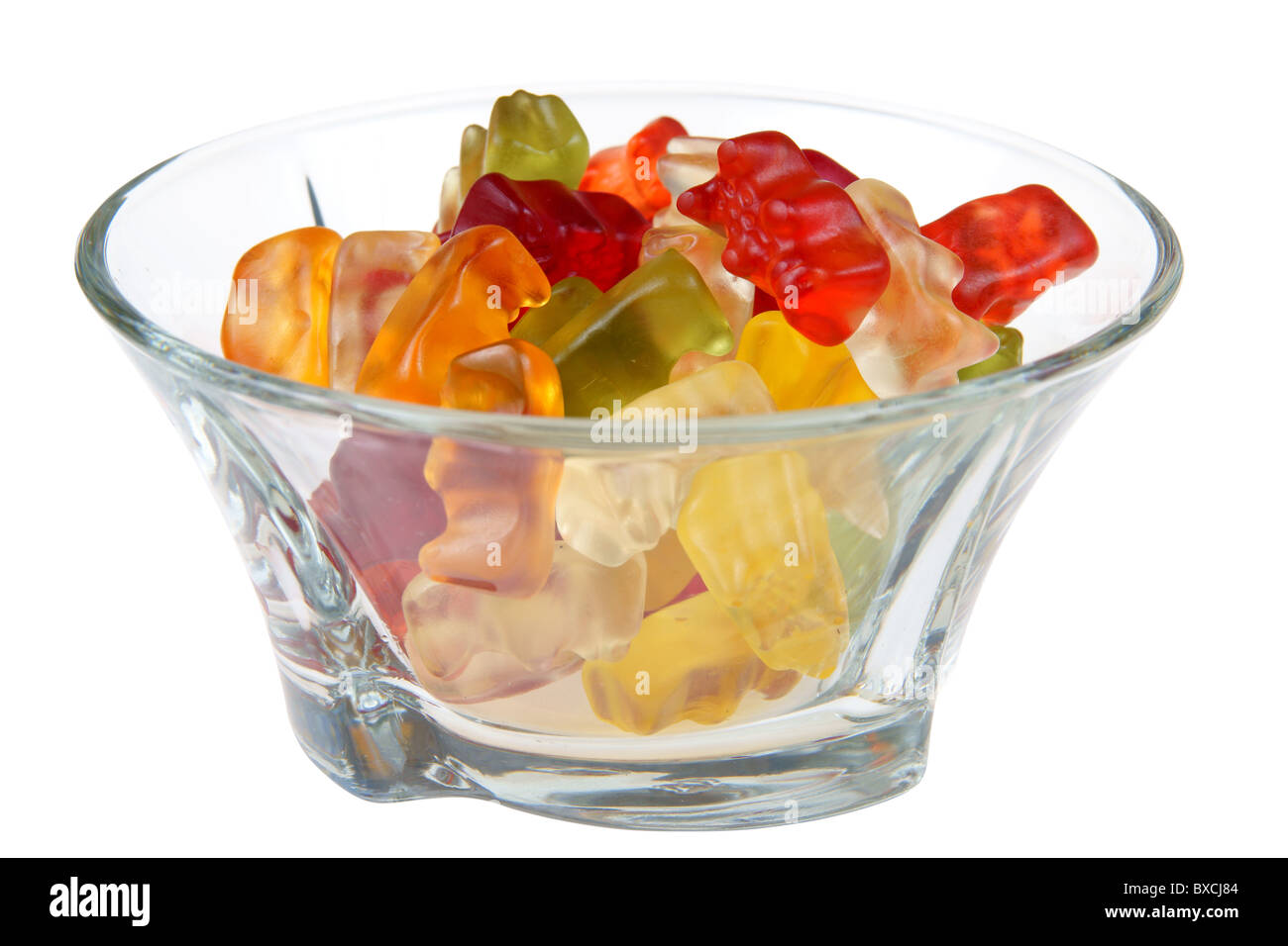 Gummy bears in glass bowl isolated on white background Stock Photo
