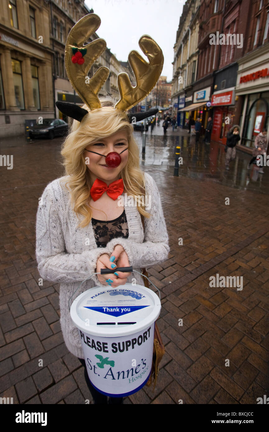 charity collector. Charity fundraiser, high school pupil in festive costume collecting in Newport City centre South Wales UK Stock Photo