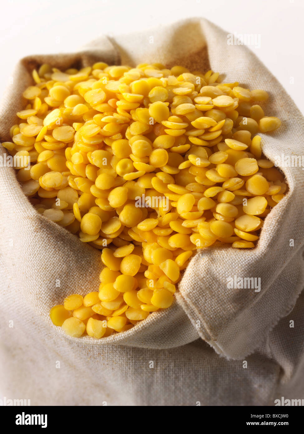 un-cooked organic yellow lentils Stock Photo