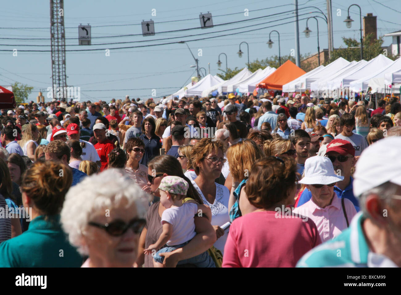 A crowd of people at a street festival. Beavercreek Popcorn Festival. Beavercreek, Ohio, USA. Stock Photo