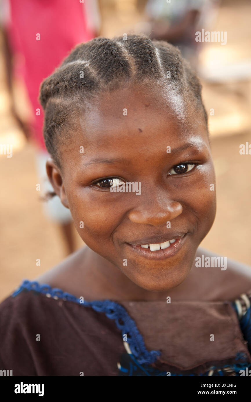 A school girl wears a smile in Freetown, Sierra Leone, West Africa. Stock Photo