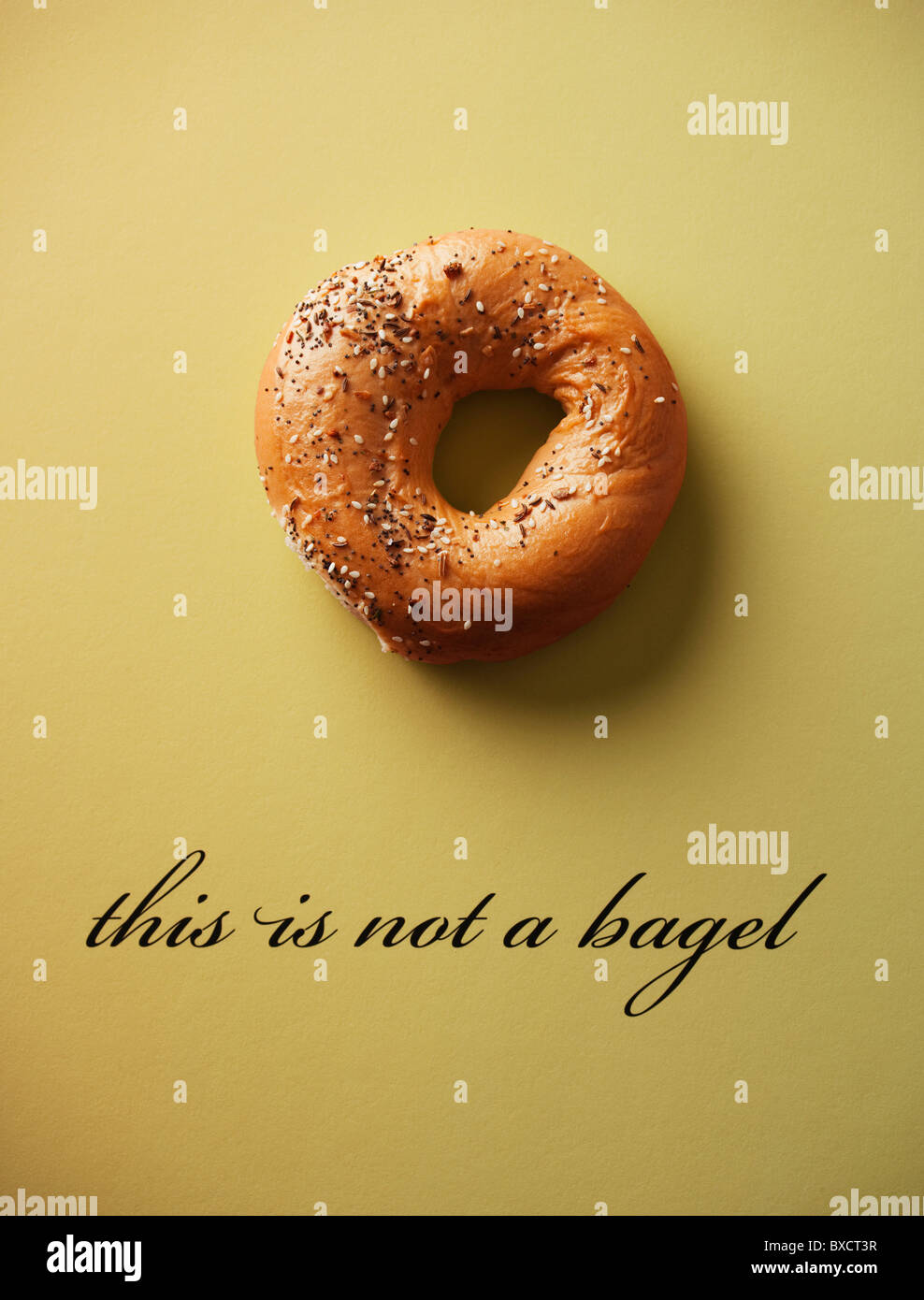 this is not a bagel on yellow paper Stock Photo