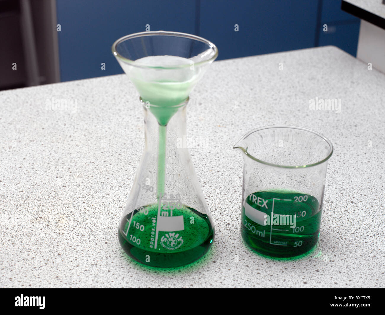 Filter Funnel being used to Filter a Mixture Stock Photo Alamy