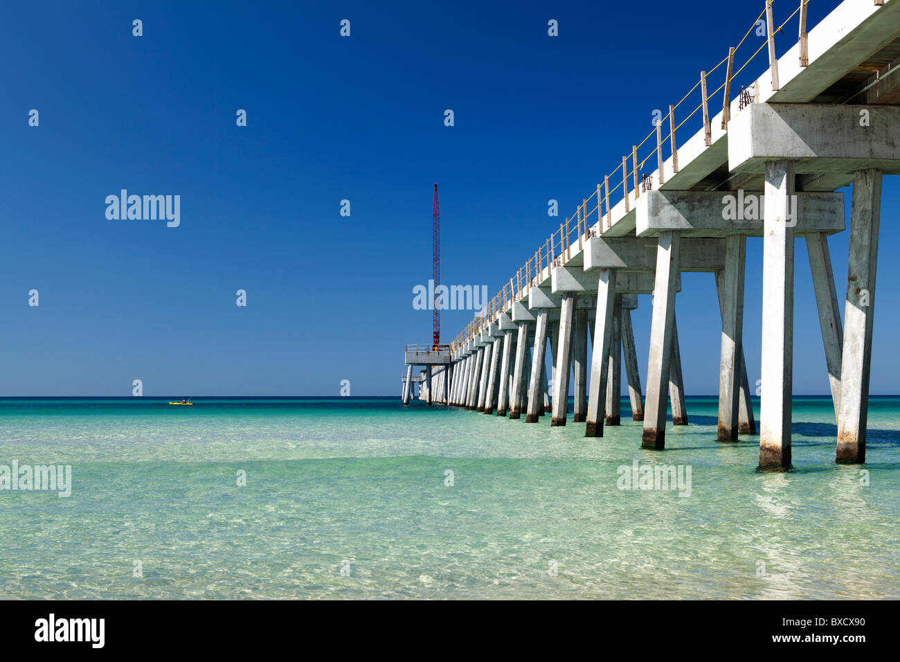2010 construction of fishing pier and crystal clear water at Panama City Beach, Florida Stock