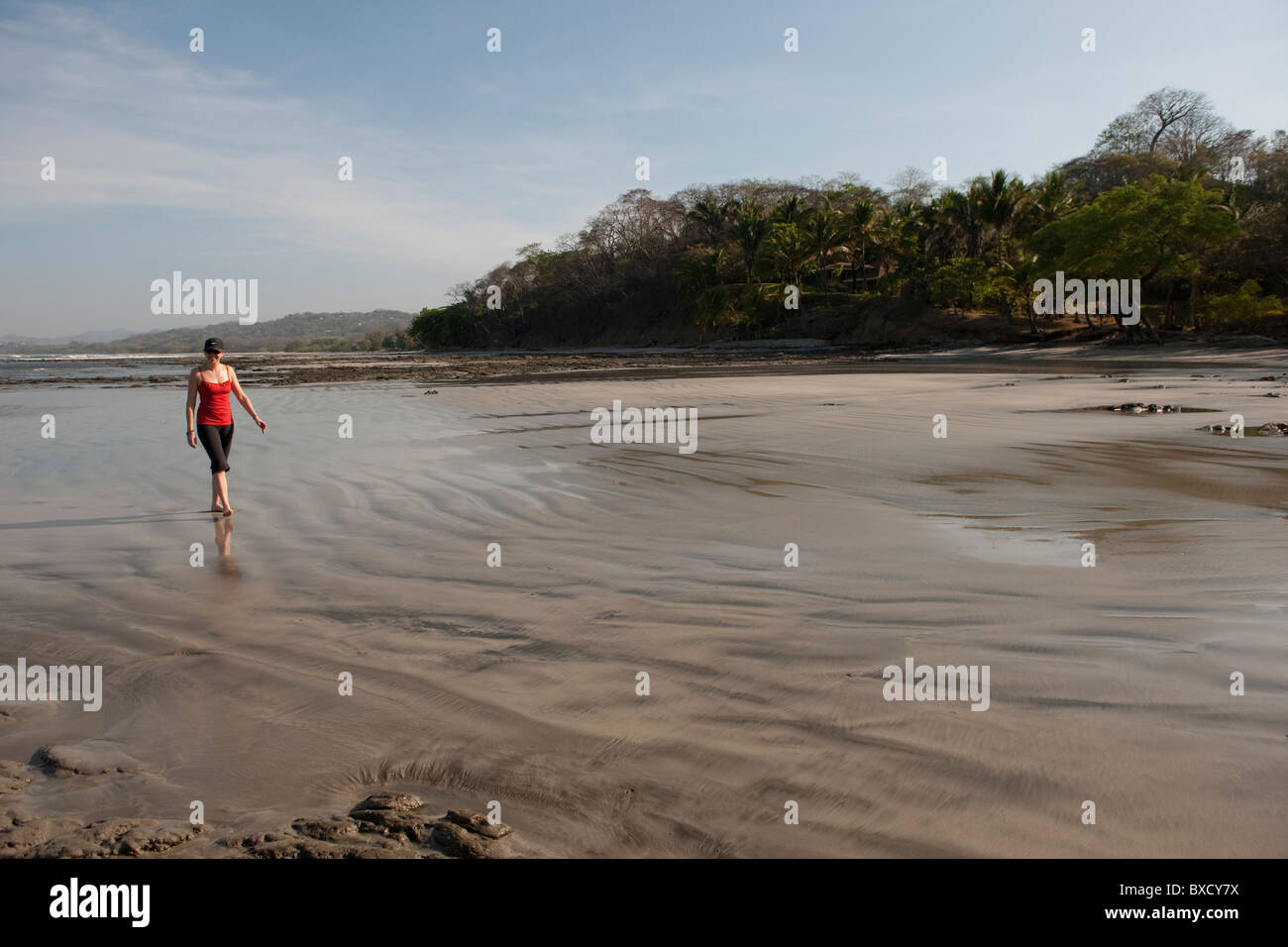 Woman walking on the beach, San Jose Costa Rica Stock Photo