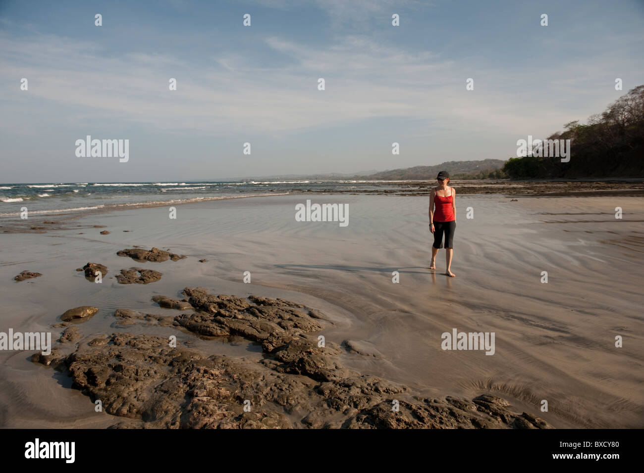 Woman walking on the beach, San Jose Costa Rica Stock Photo