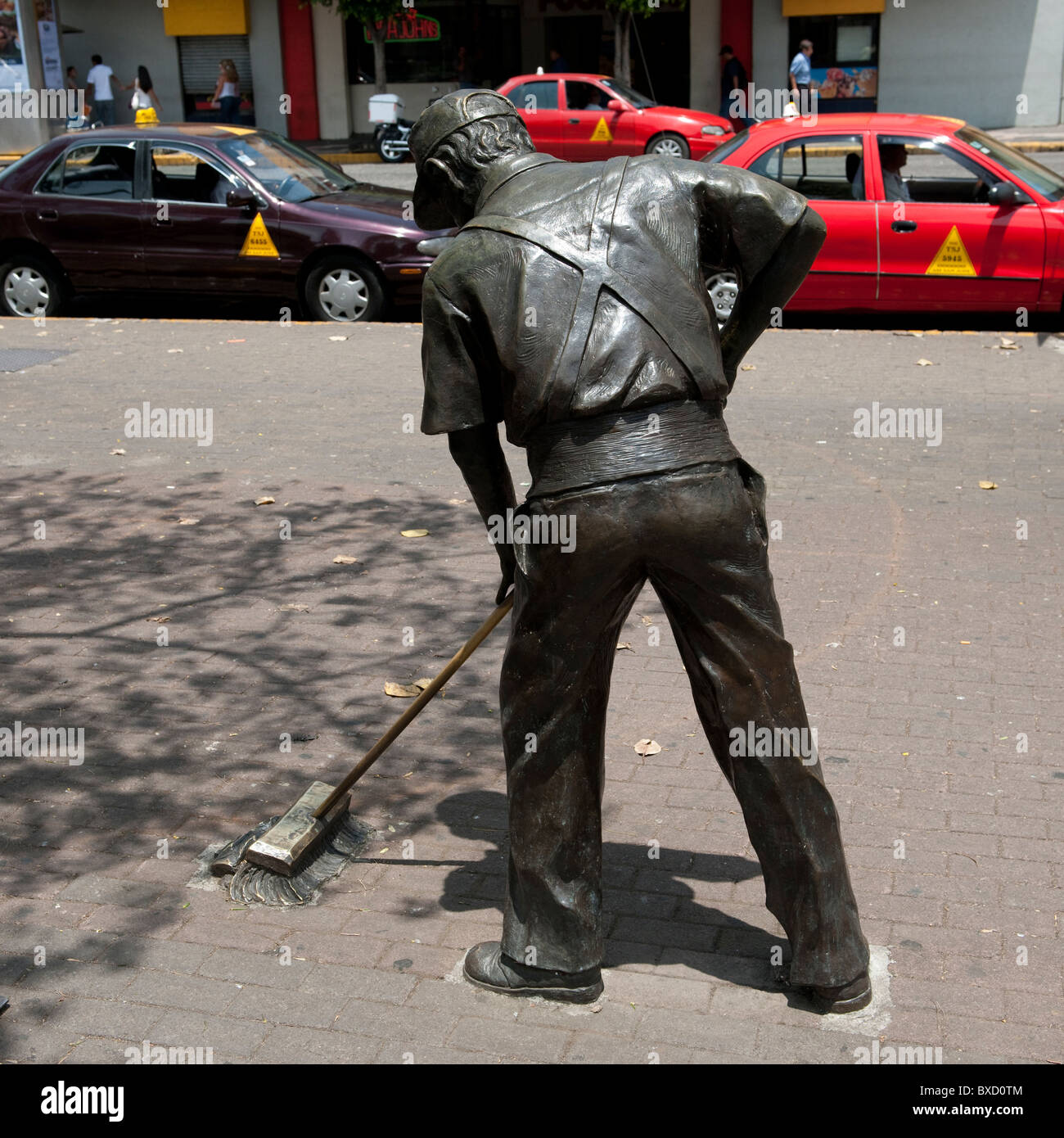 Sculpture of a man sweeping the street in San Jose Costa Rica Stock Photo Alamy