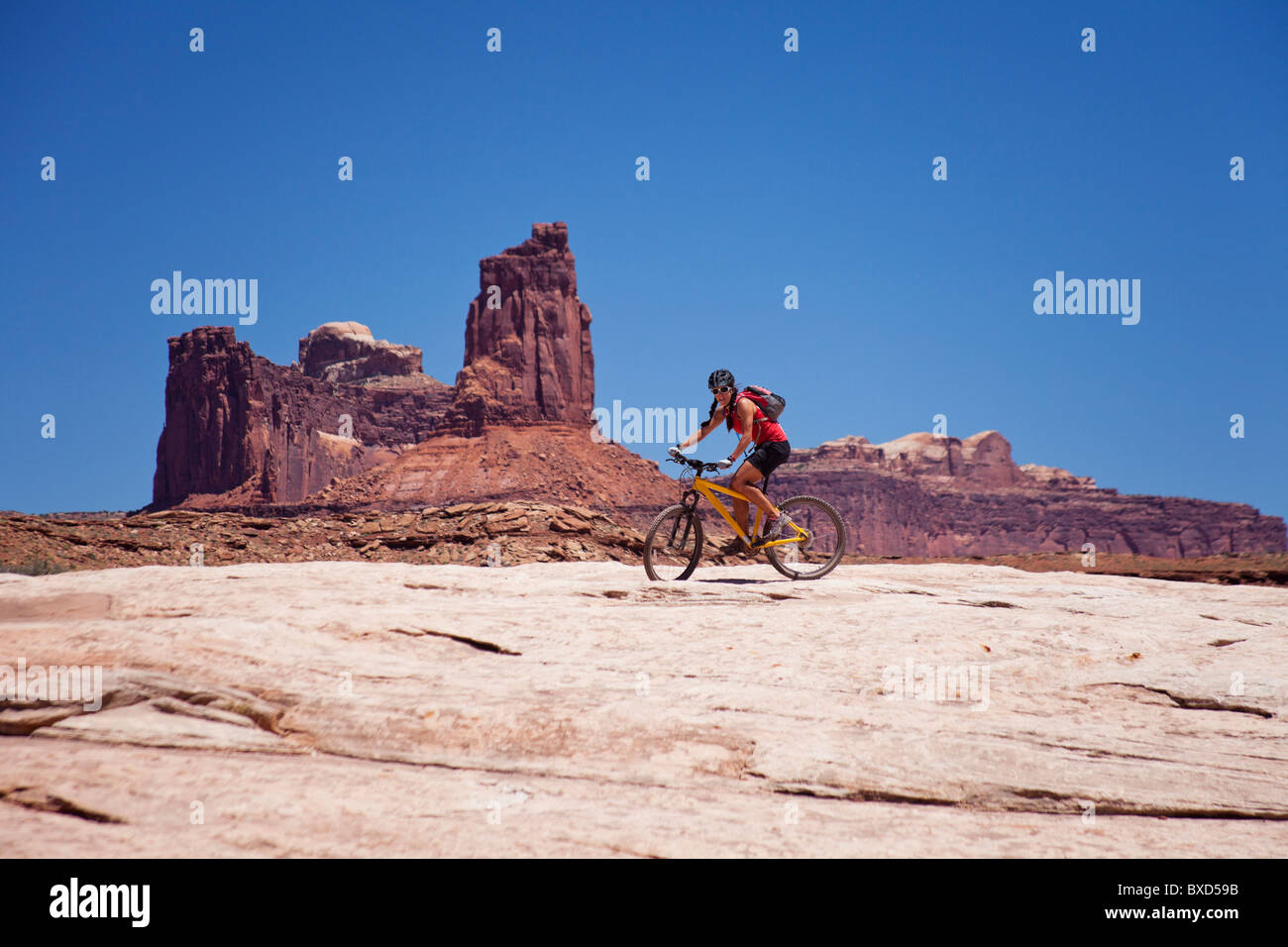 A woman bikes the White Rim trail in Utah Stock Photo Alamy