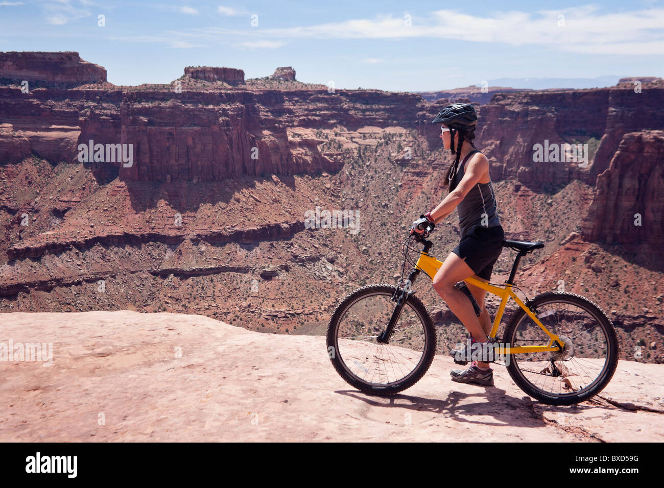 A woman bikes the White Rim trail in Utah Stock Photo Alamy