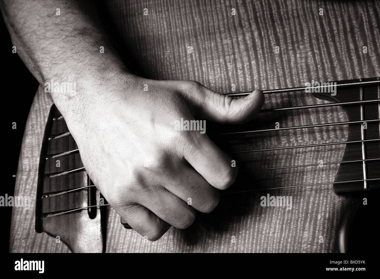 playing sixstring electric bass guitar; slap technique; right hand