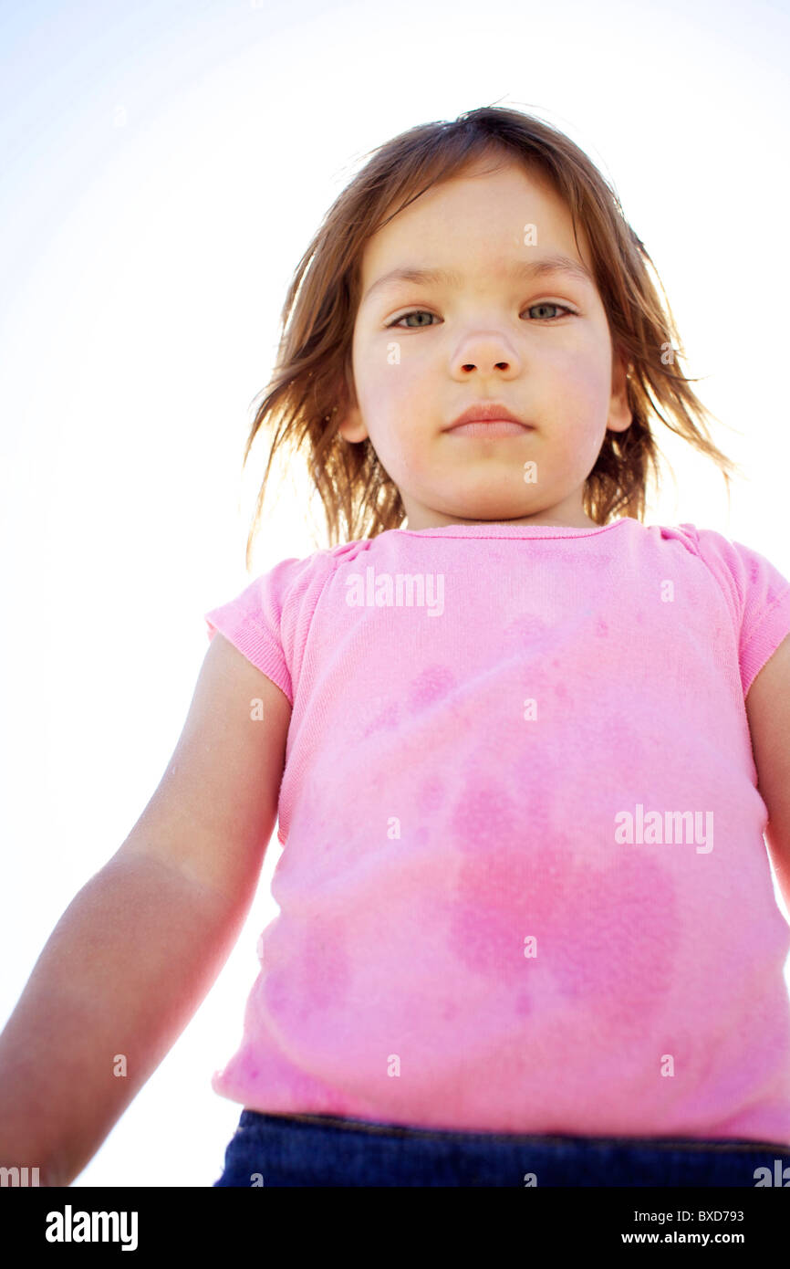 Young girl wearing pink looks down at the camera Stock Photo Alamy