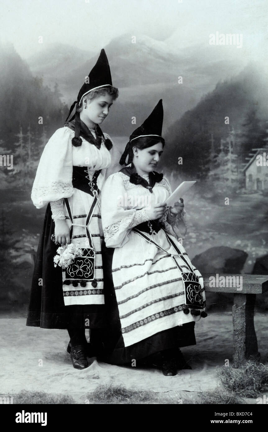 Portrait of Two Hungarian Women in Folk Costume, Folkloric Dress, Traditional Costume or National Costume with Pointed Hats, Hungary. c1900 Stock Photo