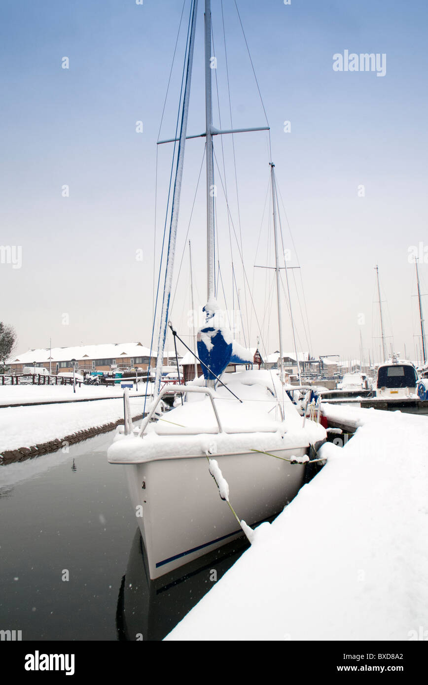 sailing yacht covered in snow in a marina Stock Photo Alamy