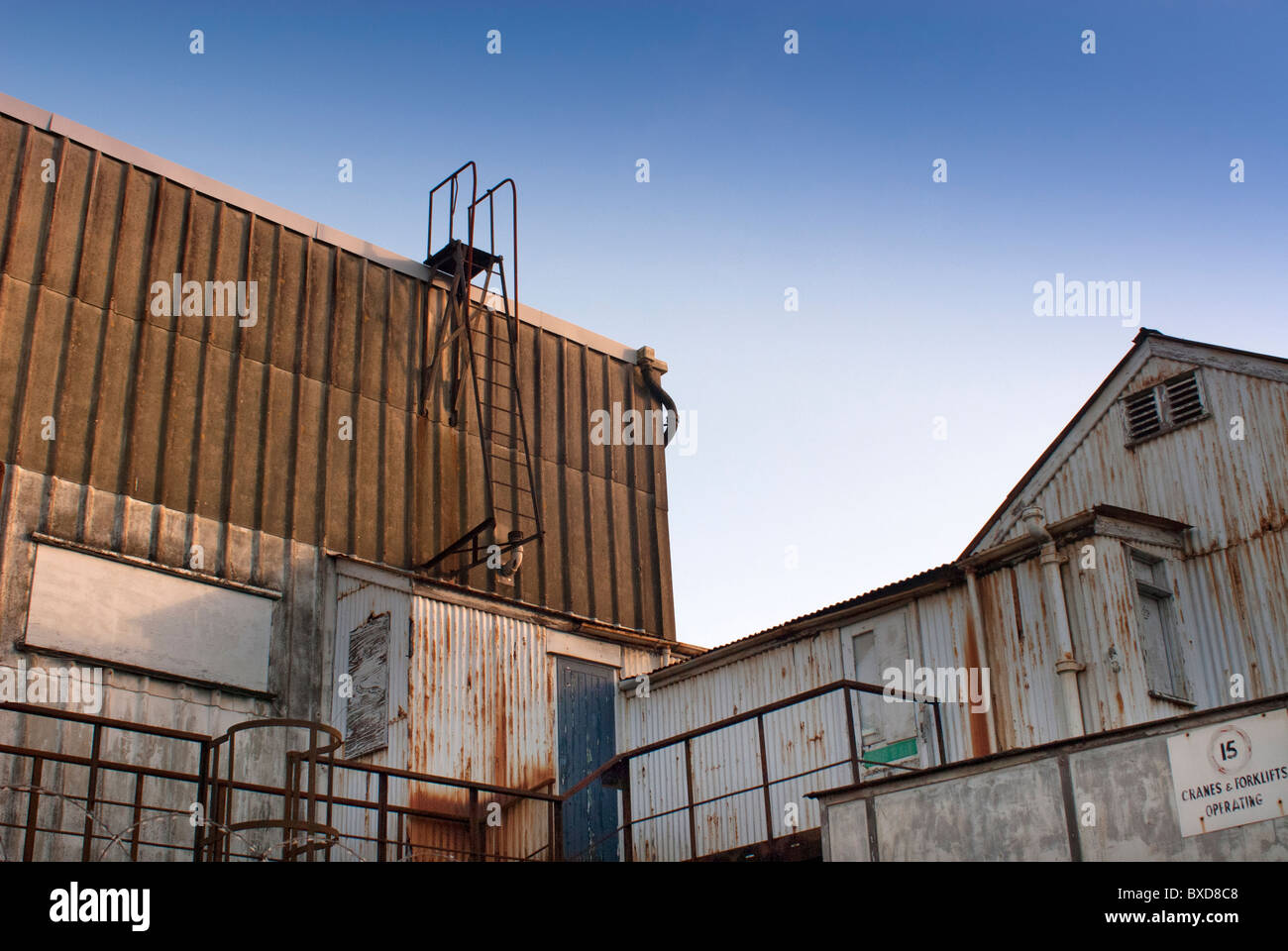 rundown warehouse with a blue sky Stock Photo