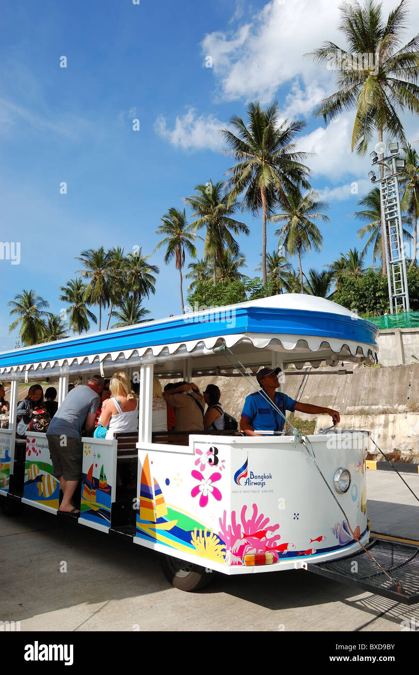 The mini bus of Bangkok Airlines loading tourists at Samui Airport, Thailand Stock Photo