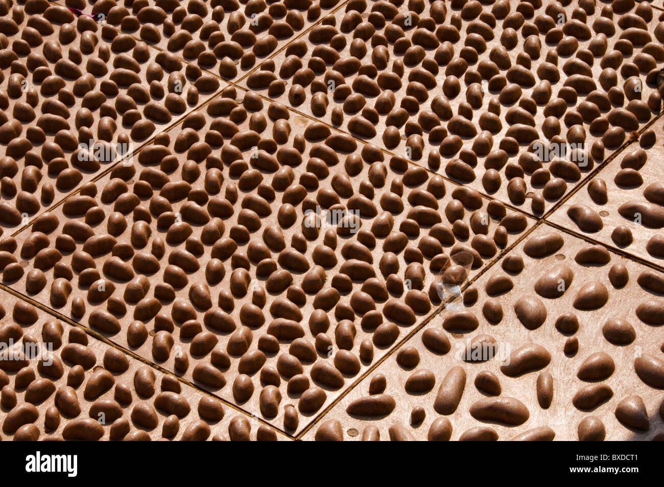 Rocks inlaid for Chinese foot massage in sidewalk in Hong Kong China