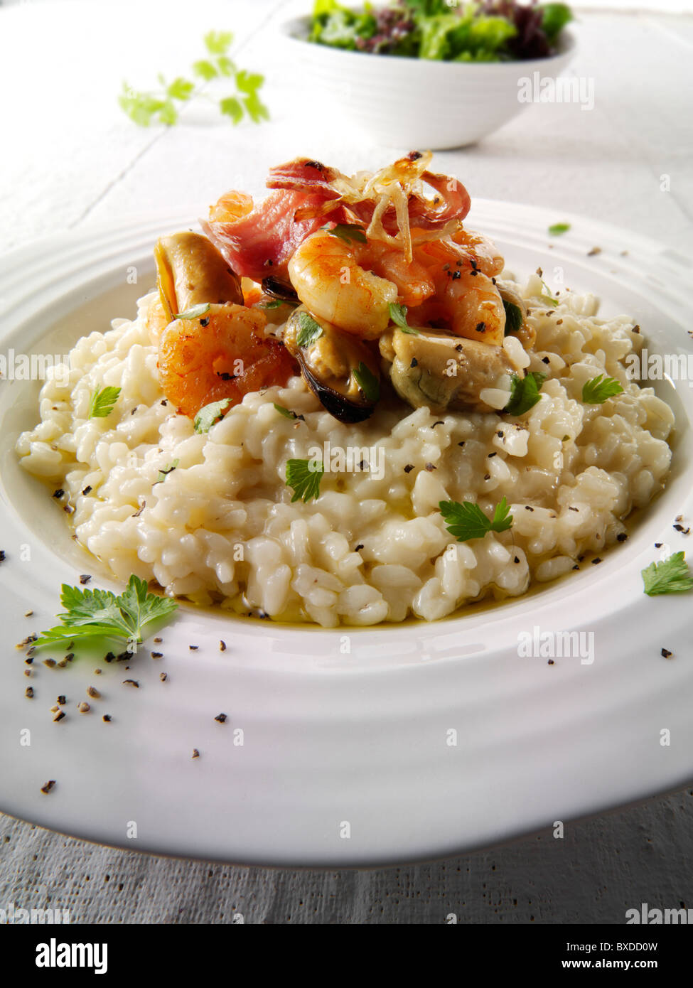Classic risotto with prawns, mussels and bacon Stock Photo Alamy