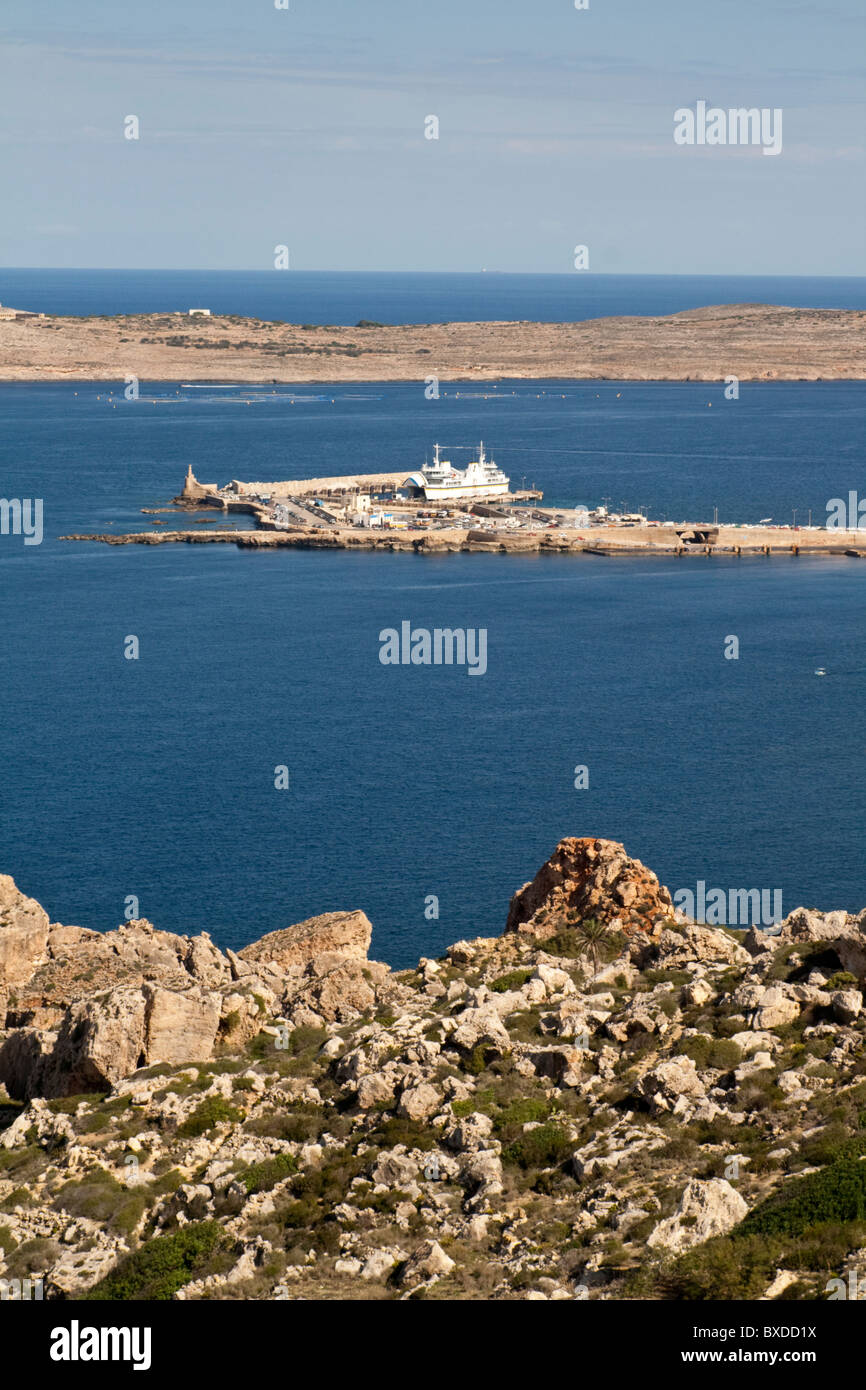 View over Cirkewwa, North West Malta with the island of Comino behind from Paradise Bay Stock Photo