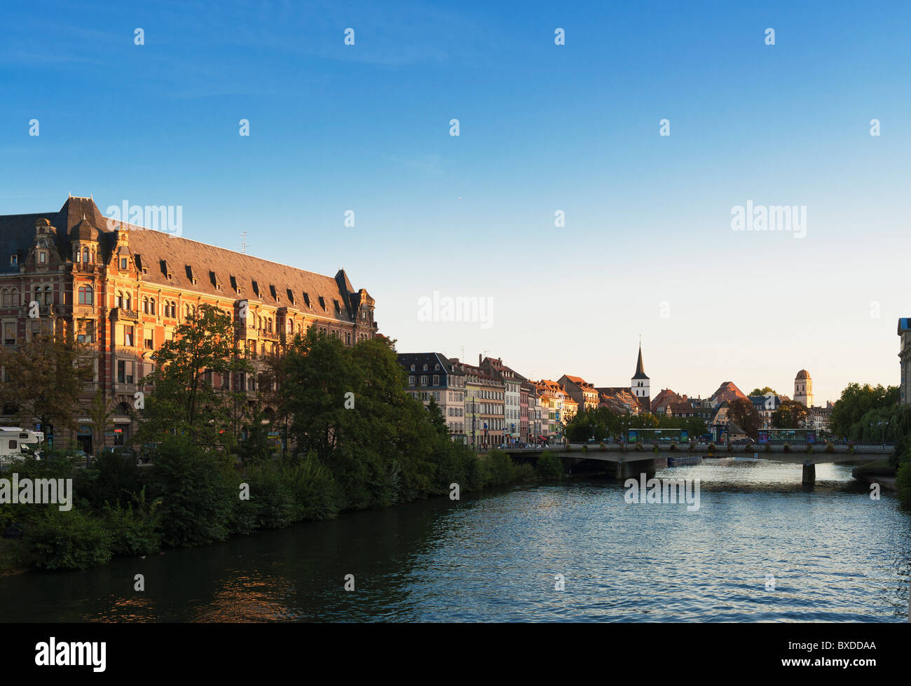 Gallia building, student residence, dorm accomodation, Ill river, waterfront houses perspective, sunset, Strasbourg, Alsace, France, Europe, Stock Photo