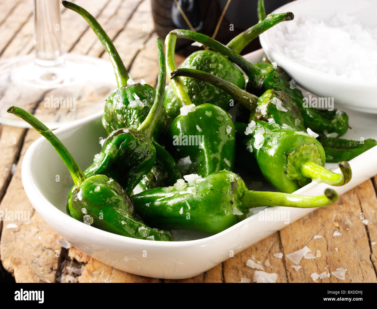 Whole griddled Padron peppers snack with sea salt Stock Photo Alamy
