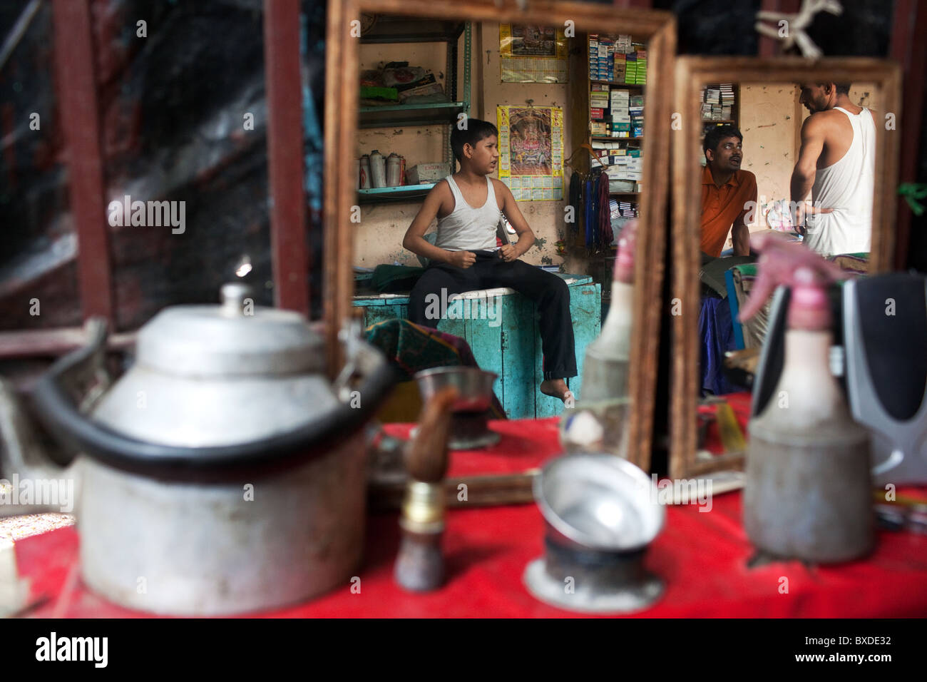 A reflection of people in a mirror in a lane in Old Delhi, capital of India. Stock Photo