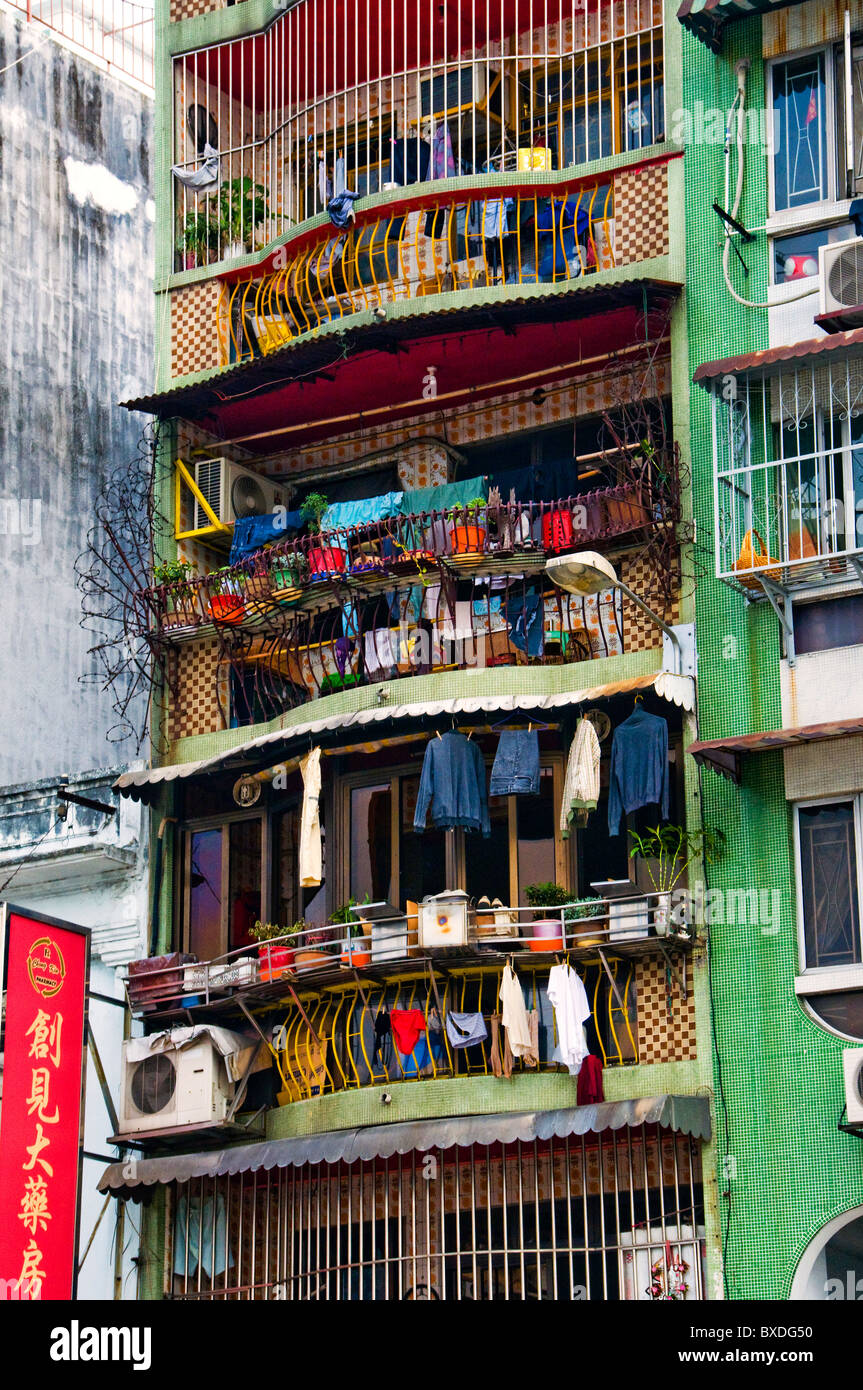 Clothes drying outside apartment in Macau Hong Kong China Stock Photo