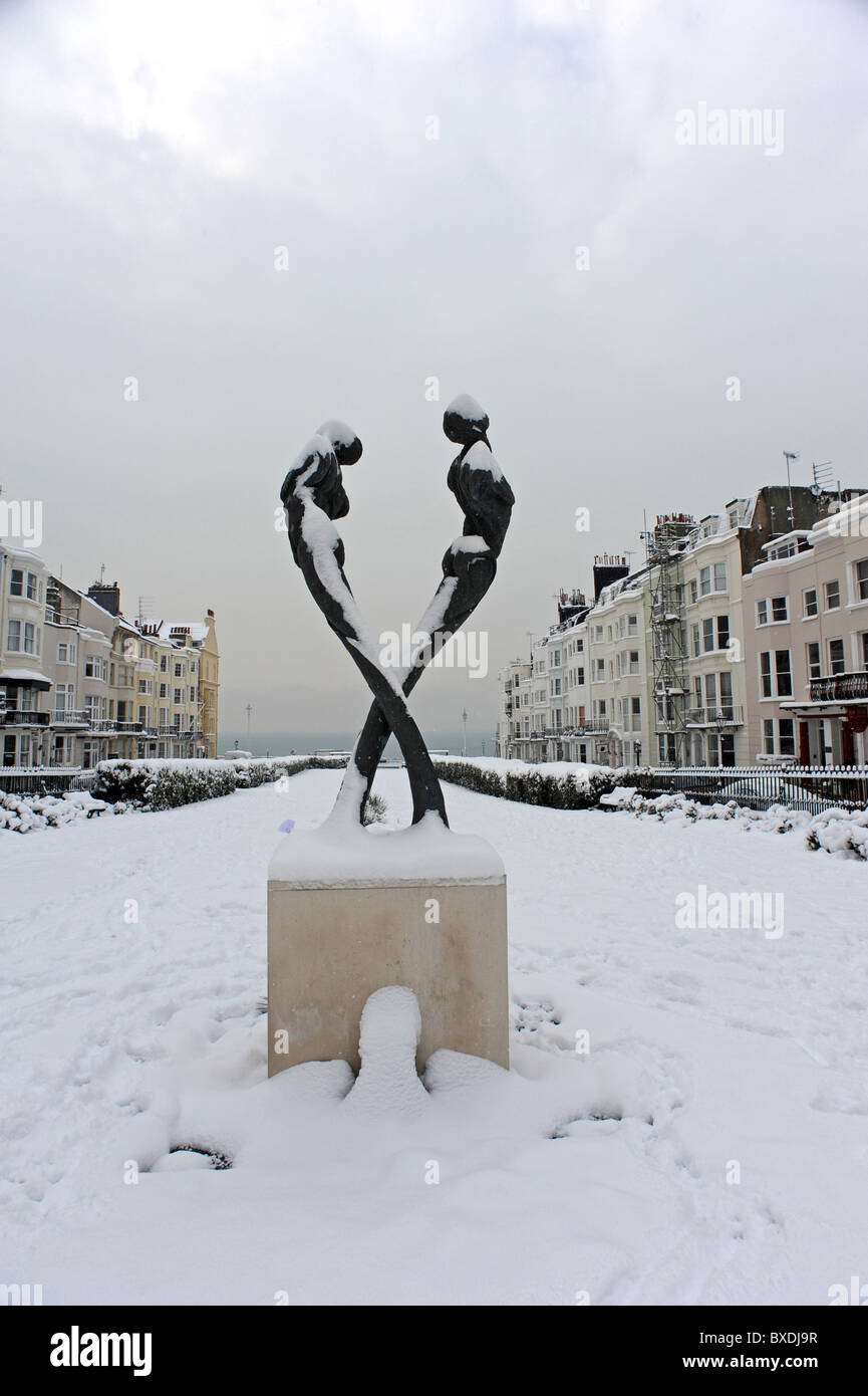 The Aids memorial statue by sculptor Romany Mark Bruce covered in snow in Kemp Town Brighton Stock Photo