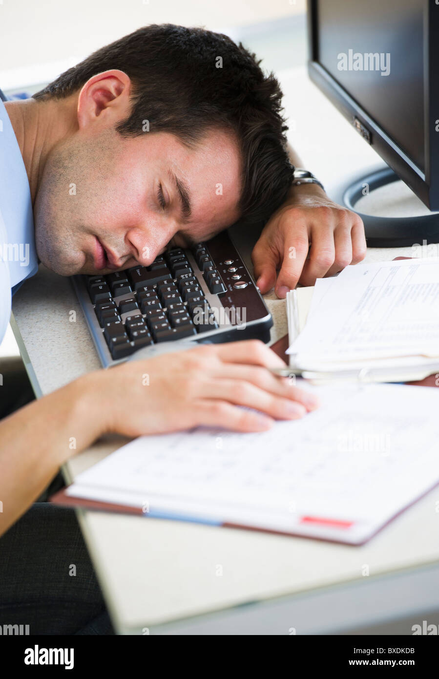 Businessman Asleep At His Desk Stock Photo Alamy