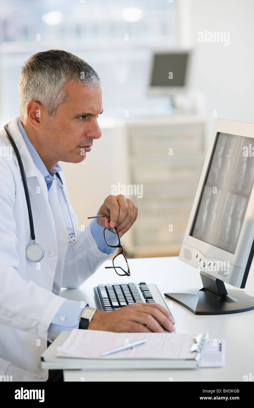 Doctor working on computer Stock Photo