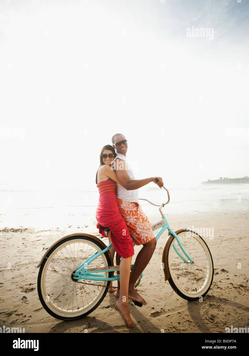 Hispanic Man Riding Bike Hispanic man riding bike beach hi-res stock photography and images - Alamy