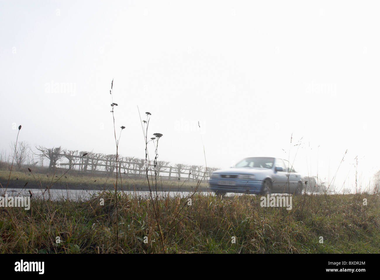 Car driving in fog UK Stock Photo Alamy