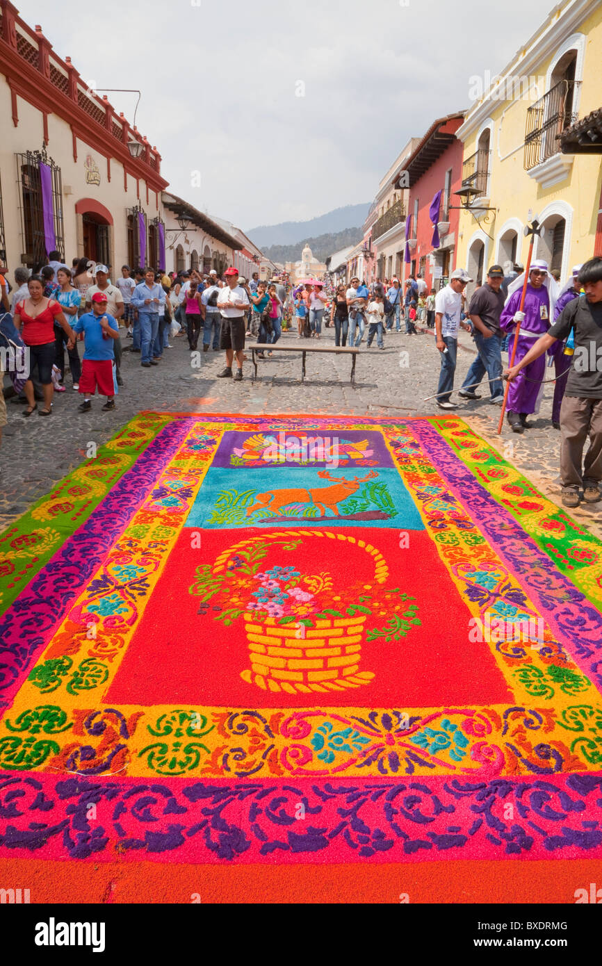 Antigua, Guatemala. An alfombra (carpet) of colored sawdust decorates the street in advance of the passage of a procession. Stock Photo